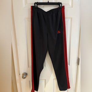 Men’s Adidas pants. Size large. Black with red stripes. Like new condition.